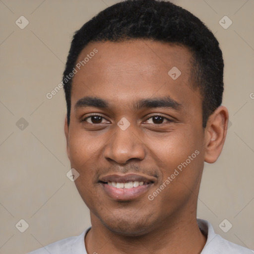 Joyful black young-adult male with short  black hair and brown eyes