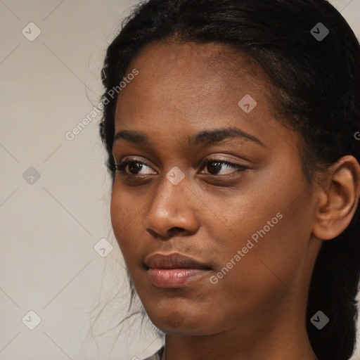 Neutral black young-adult female with medium  brown hair and brown eyes