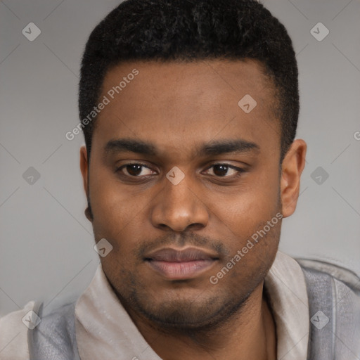 Joyful latino young-adult male with short  brown hair and brown eyes
