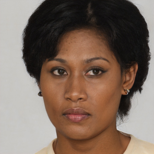 Neutral asian adult female with short  black hair and brown eyes