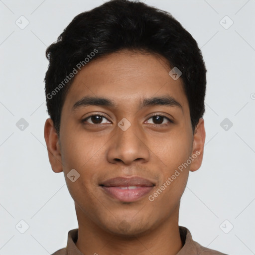 Joyful latino young-adult male with short  black hair and brown eyes
