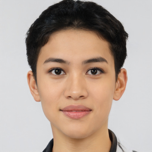 Joyful latino young-adult female with short  black hair and brown eyes