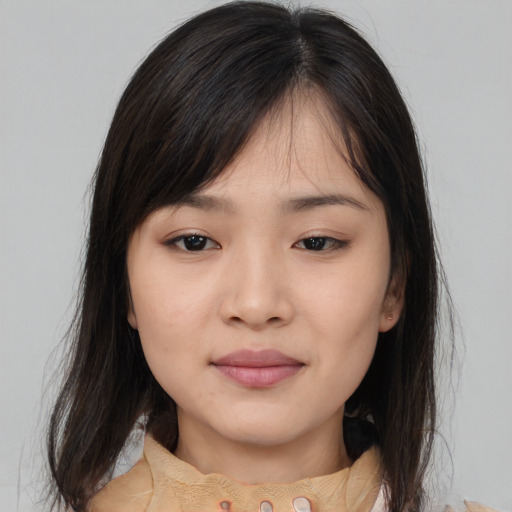 Neutral asian young-adult female with medium  brown hair and brown eyes