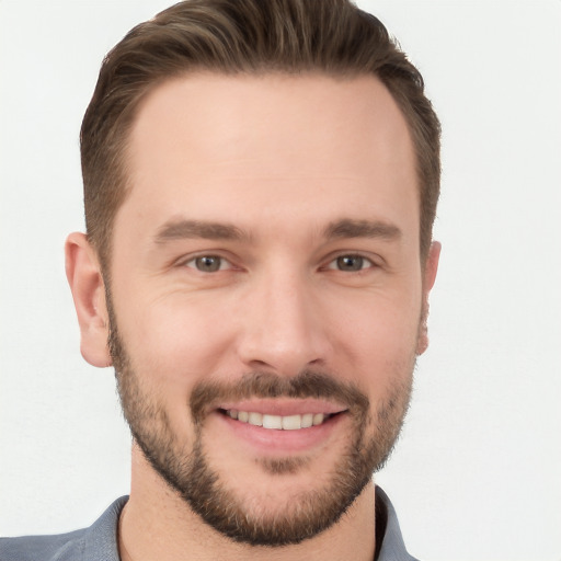 Joyful white young-adult male with short  brown hair and brown eyes