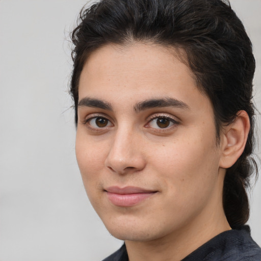 Joyful white young-adult male with medium  brown hair and brown eyes