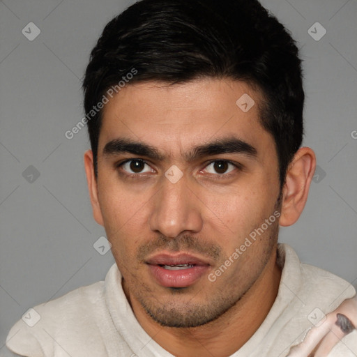 Joyful white young-adult male with short  black hair and brown eyes