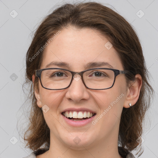 Joyful white adult female with medium  brown hair and grey eyes