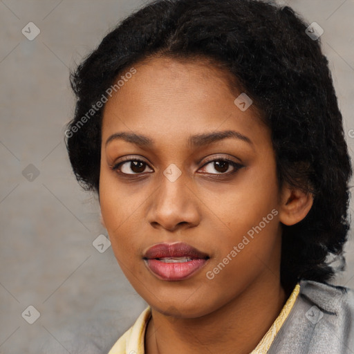 Joyful black young-adult female with long  black hair and brown eyes