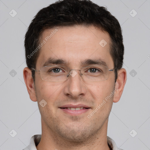 Joyful white adult male with short  brown hair and brown eyes