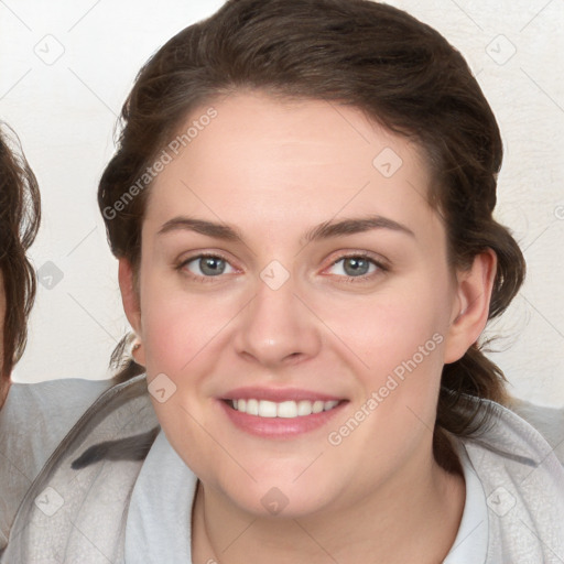 Joyful white young-adult female with medium  brown hair and blue eyes