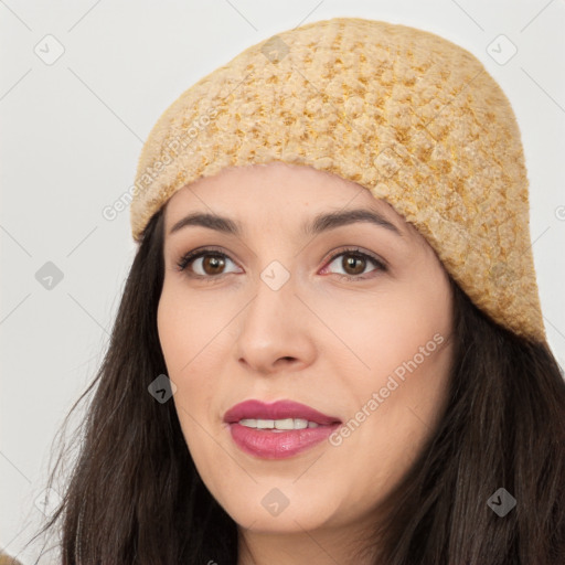 Joyful white young-adult female with long  black hair and brown eyes