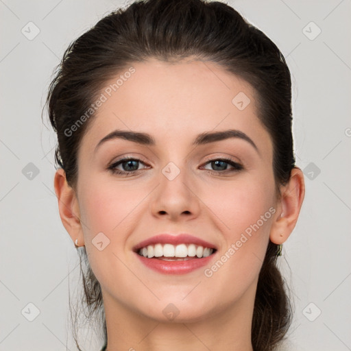 Joyful white young-adult female with long  brown hair and grey eyes