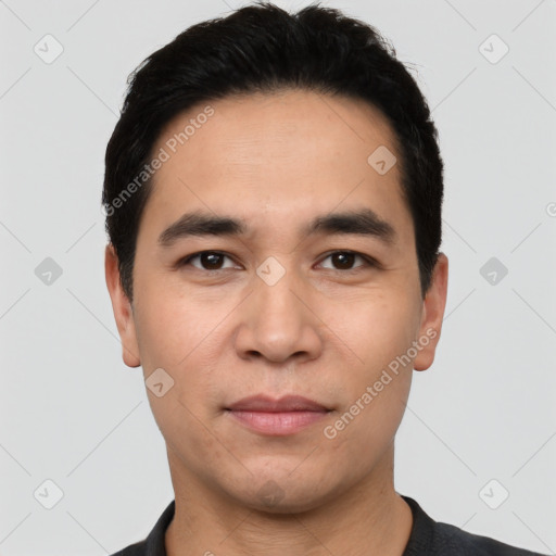 Joyful asian young-adult male with short  black hair and brown eyes