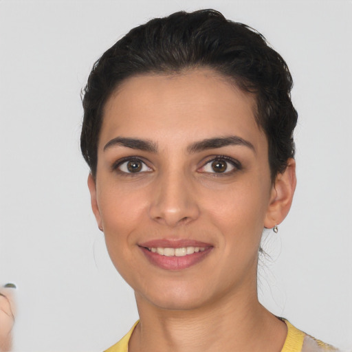 Joyful white young-adult female with short  brown hair and brown eyes