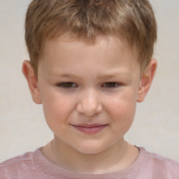 Joyful white child male with short  brown hair and brown eyes