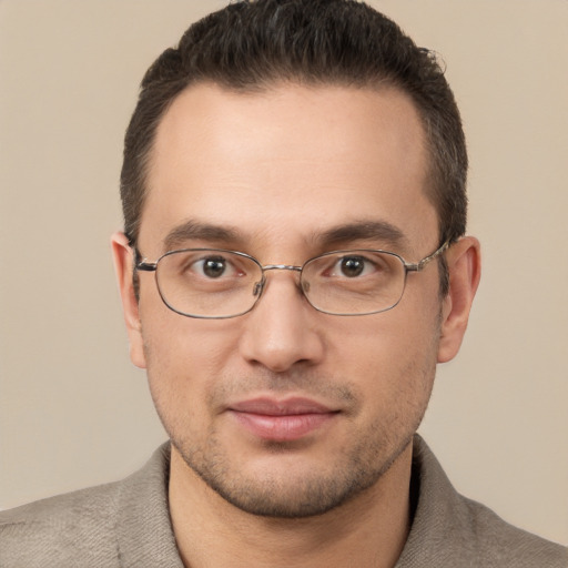 Joyful white adult male with short  brown hair and brown eyes