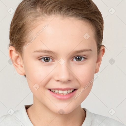 Joyful white child female with short  brown hair and brown eyes