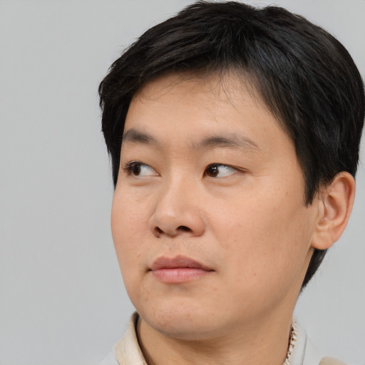 Neutral asian young-adult male with short  black hair and brown eyes