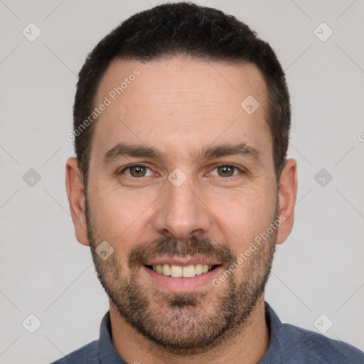 Joyful white adult male with short  brown hair and brown eyes