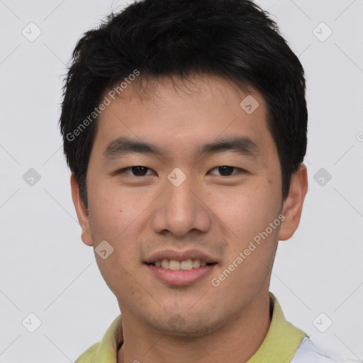 Joyful asian young-adult male with short  black hair and brown eyes