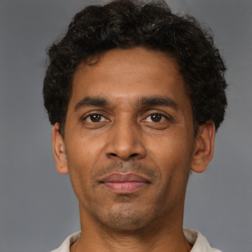 Neutral latino young-adult male with short  brown hair and brown eyes
