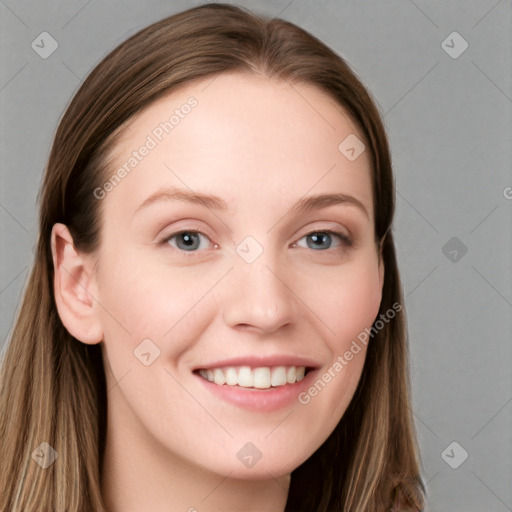 Joyful white young-adult female with long  brown hair and blue eyes