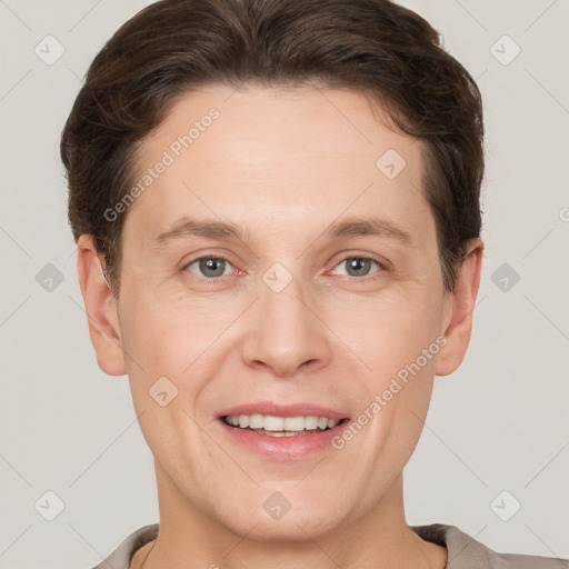 Joyful white adult male with short  brown hair and grey eyes