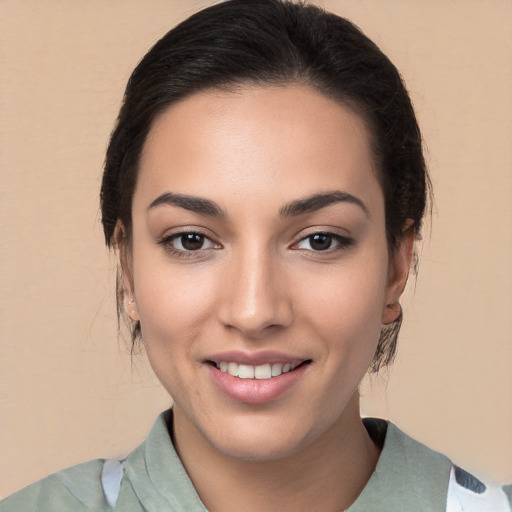 Joyful white young-adult female with medium  black hair and brown eyes