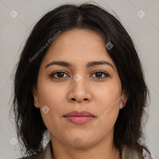 Joyful latino young-adult female with long  brown hair and brown eyes