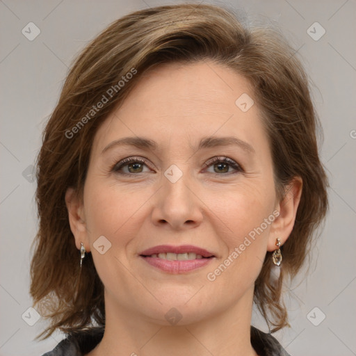 Joyful white adult female with medium  brown hair and grey eyes