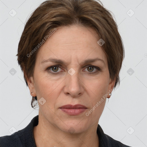 Joyful white adult female with short  brown hair and grey eyes