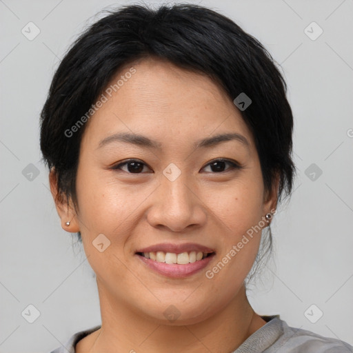 Joyful asian young-adult female with short  brown hair and brown eyes