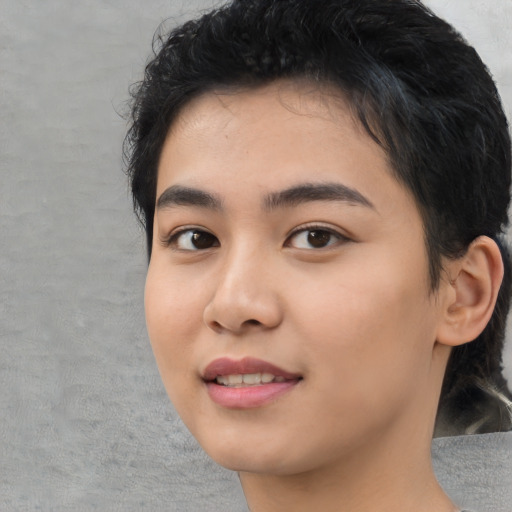 Joyful asian young-adult female with short  black hair and brown eyes