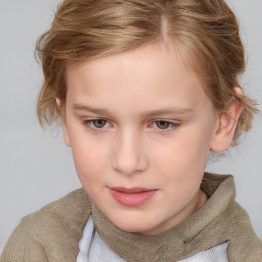 Joyful white child female with short  brown hair and blue eyes