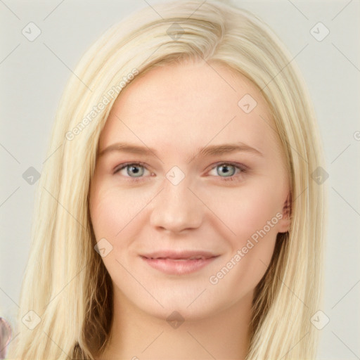 Joyful white young-adult female with long  brown hair and blue eyes