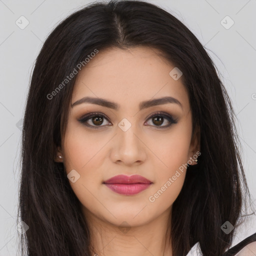 Joyful latino young-adult female with long  brown hair and brown eyes