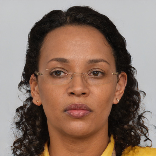Neutral black adult female with medium  brown hair and brown eyes