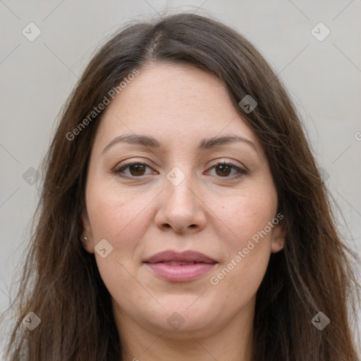 Joyful white adult female with long  brown hair and grey eyes