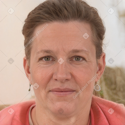 Joyful white adult female with short  brown hair and grey eyes