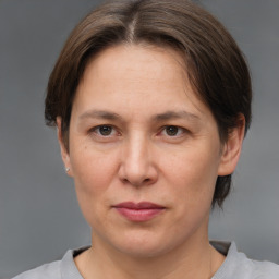 Joyful white adult female with short  brown hair and brown eyes