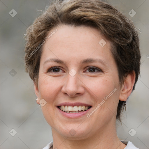 Joyful white adult female with short  brown hair and brown eyes