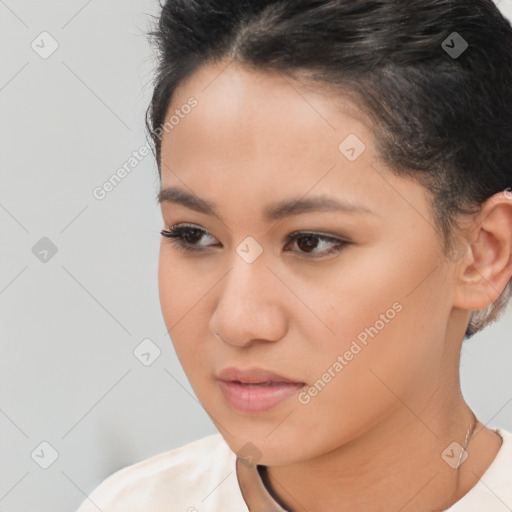 Joyful latino young-adult female with short  brown hair and brown eyes