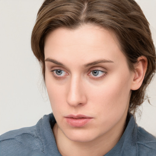 Neutral white young-adult female with medium  brown hair and blue eyes