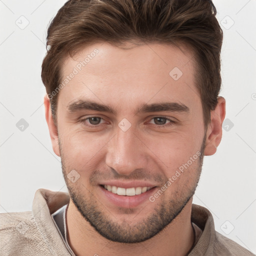 Joyful white young-adult male with short  brown hair and brown eyes