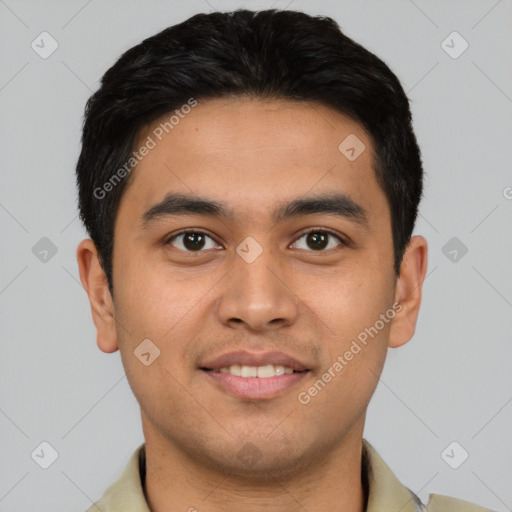 Joyful latino young-adult male with short  brown hair and brown eyes