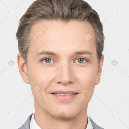 Joyful white adult male with short  brown hair and grey eyes