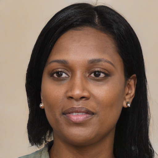 Joyful black young-adult female with medium  black hair and brown eyes