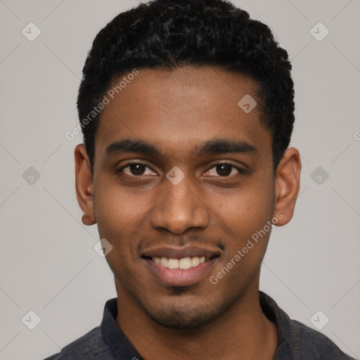 Joyful black young-adult male with short  black hair and brown eyes