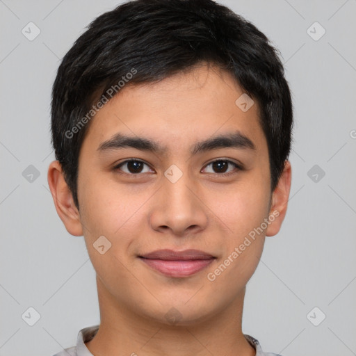 Joyful asian young-adult male with short  brown hair and brown eyes