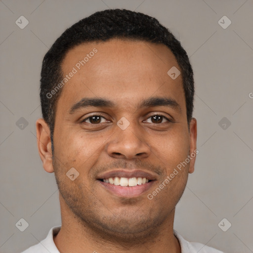 Joyful latino young-adult male with short  brown hair and brown eyes